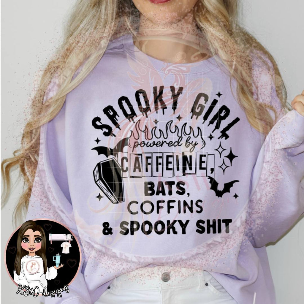 Light purple sweatshirt with Halloween-themed text worn by a person, with a small inset of a cartoon character.