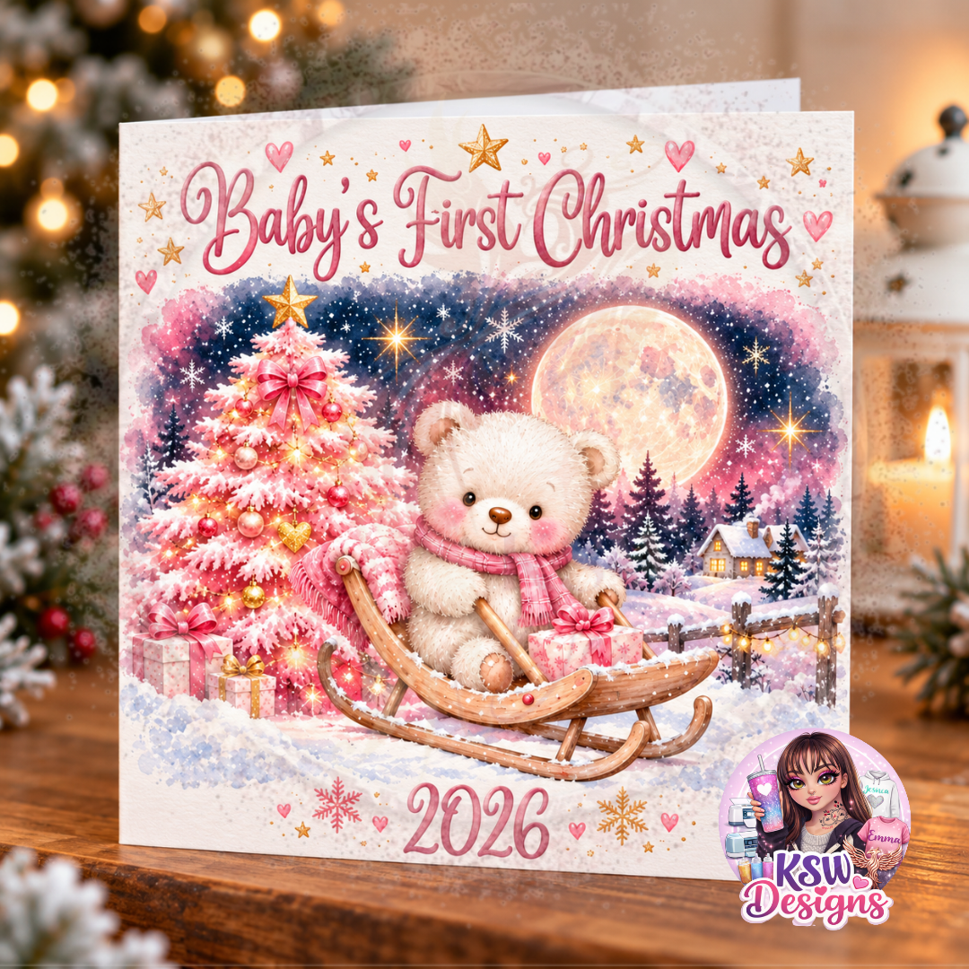 Pink Baby's First Christmas 2026 greeting card featuring a cream teddy bear wearing a pink scarf on a wooden sledge, with a pink Christmas tree, wrapped presents and snowy winter scenery.