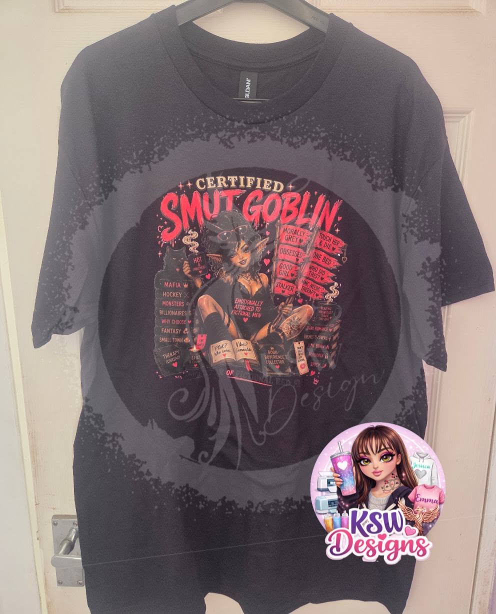 Black hoodie featuring a Certified Smut Goblin design with a female character, books and dark romance trope references in black, red and pink.
