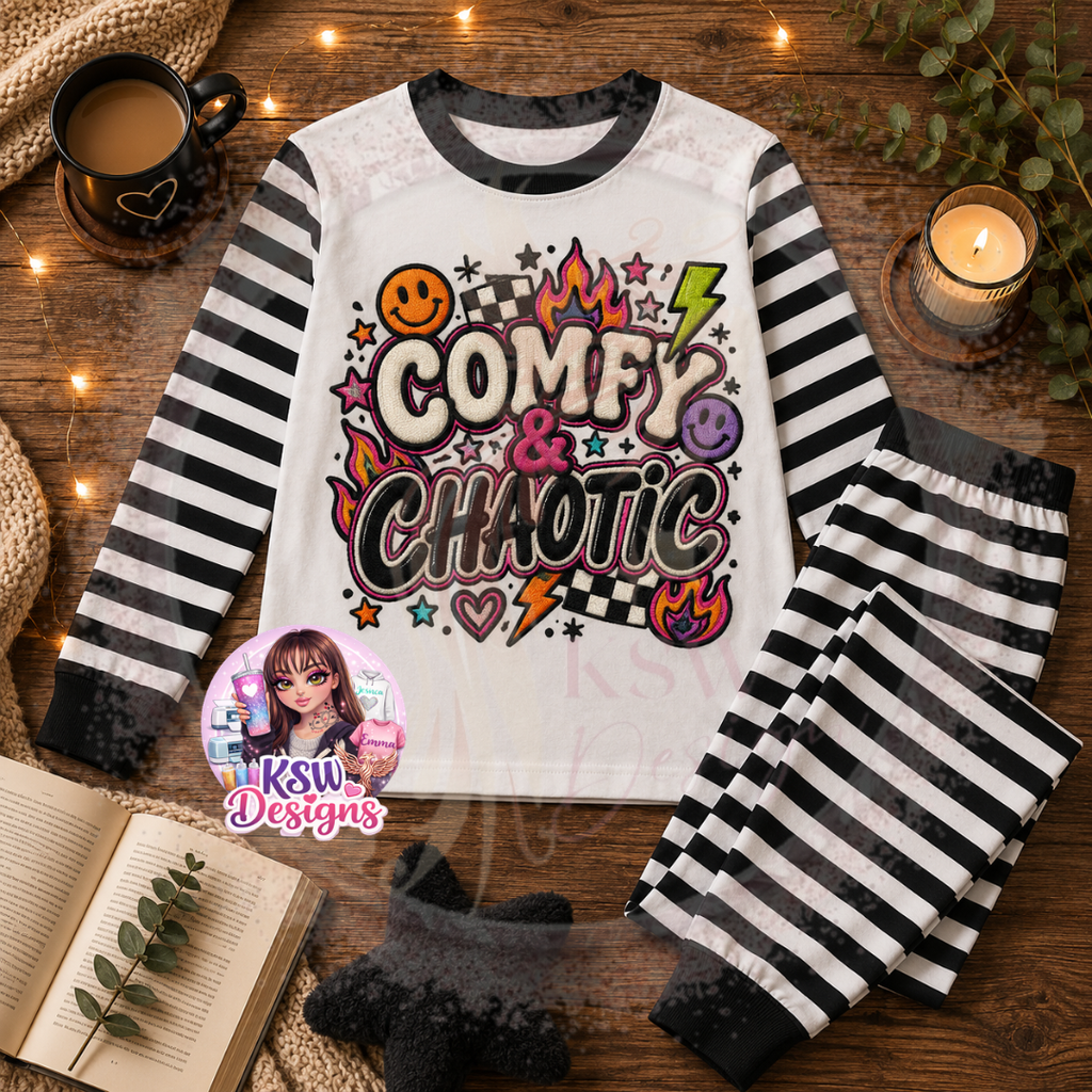 Comfy and Chaotic adult pyjama set featuring a colourful faux embroidery style alternative design with flames, checkerboard, hearts and lightning bolts on black stripe pyjamas