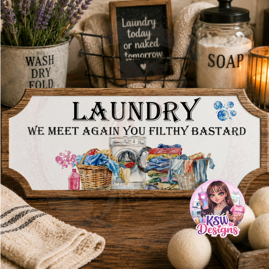 Funny acrylic laundry room shelf sign reading Laundry We Meet Again You Filthy Bastard with washing machine and laundry basket artwork.