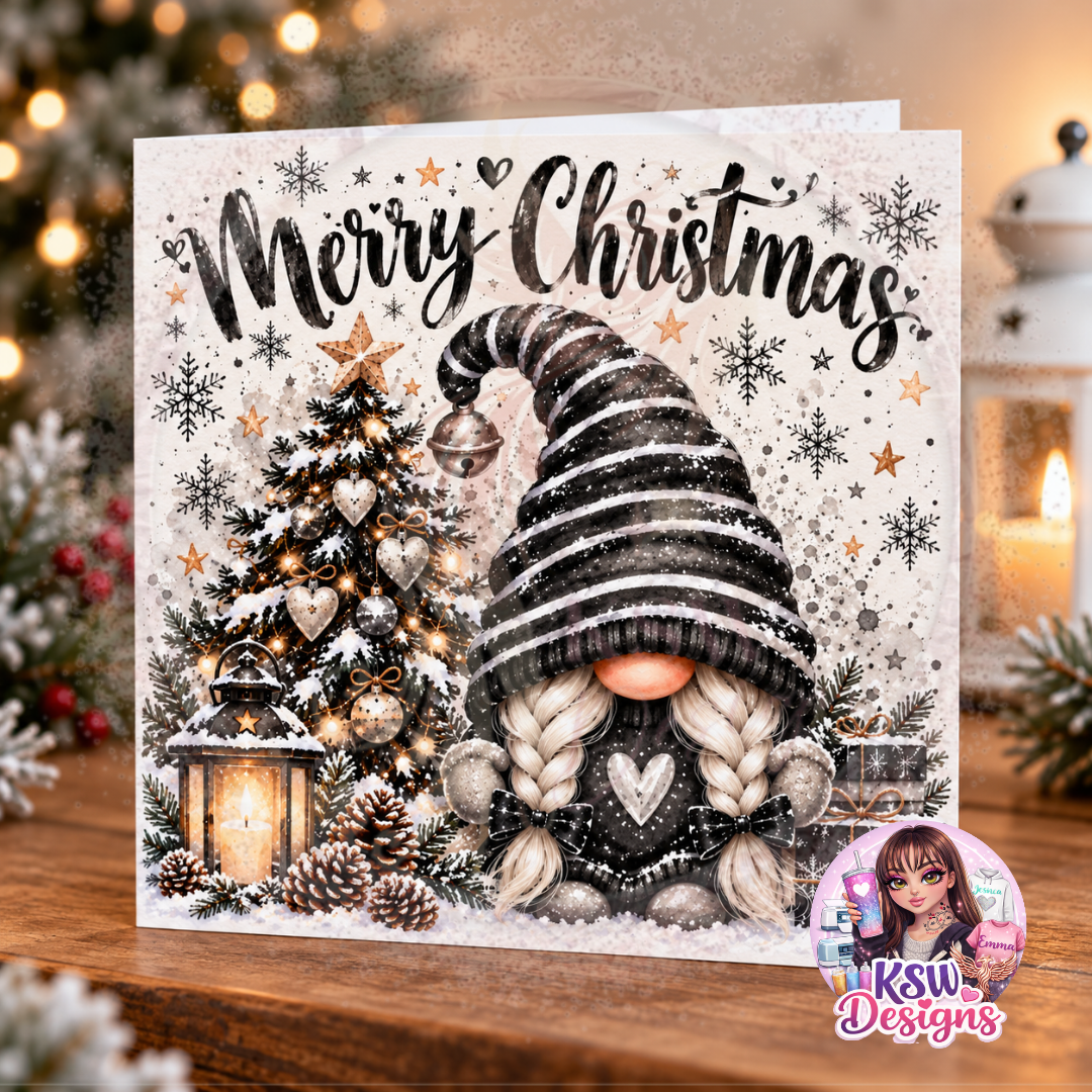 Square Christmas greeting card with Merry Christmas lettering and a cute gonk wearing a black and white striped hat, beside a snowy Christmas tree and glowing lantern.