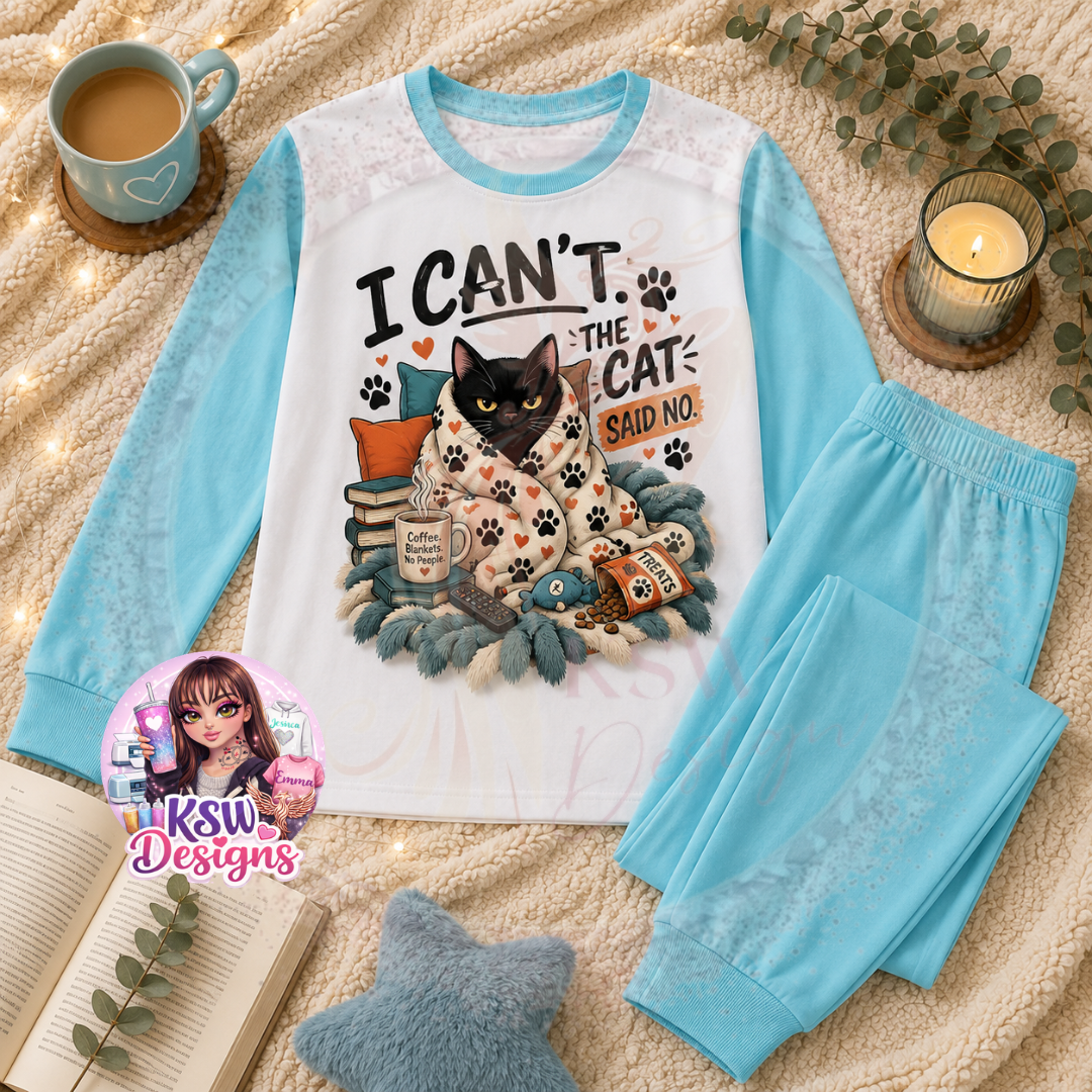 I Can’t The Cat Said No adult cat lover pyjama set featuring a funny black cat wrapped in a paw print blanket with books and treats, shown on baby blue block pyjamas