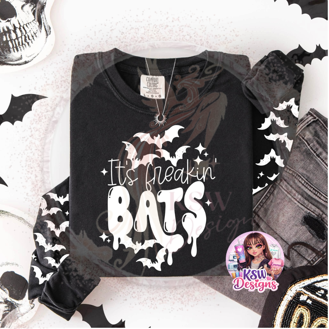 It’s Freakin’ Bats Halloween hoodie featuring flying bat graphics on the front and sleeves, available with a choice of black or white design.