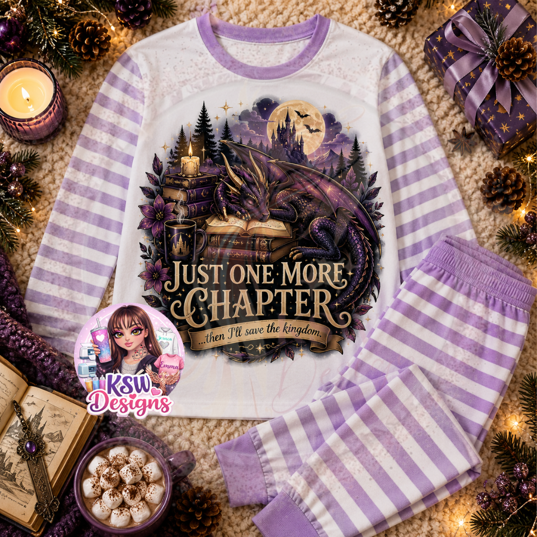 Just One More Chapter fantasy adult pyjama set featuring a purple dragon, open book, stacked books, candles and moonlit castle shown on lilac striped pyjamas