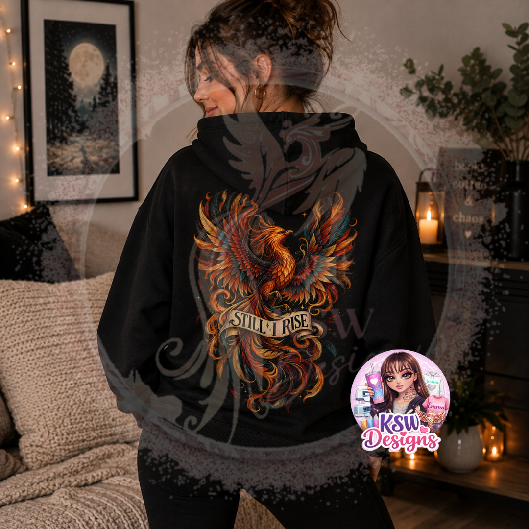 Woman wearing black zip-up hoodie with colourful Still I Rise phoenix design printed across the back