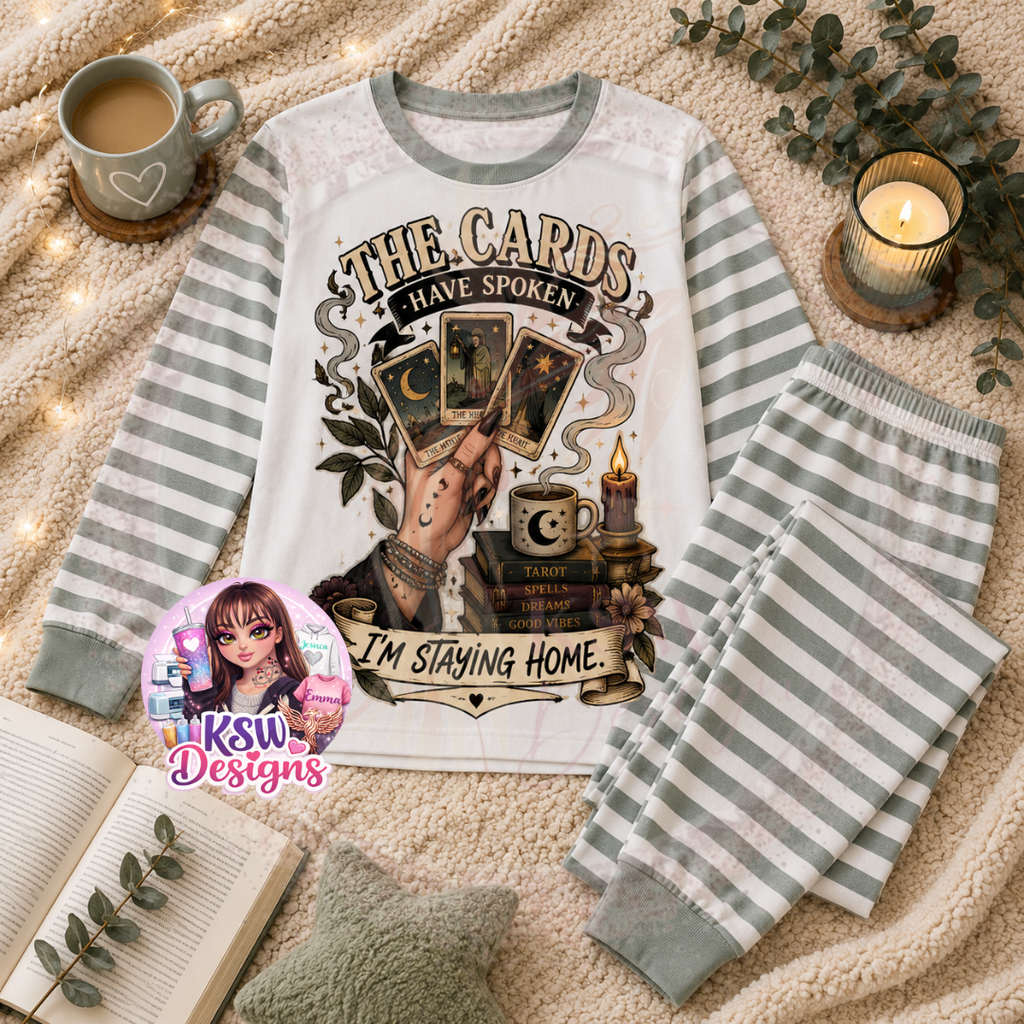 The Cards Have Spoken I'm Staying Home adult pyjama set featuring tarot cards, candles, celestial moon details and spell books shown on sage striped pyjamas