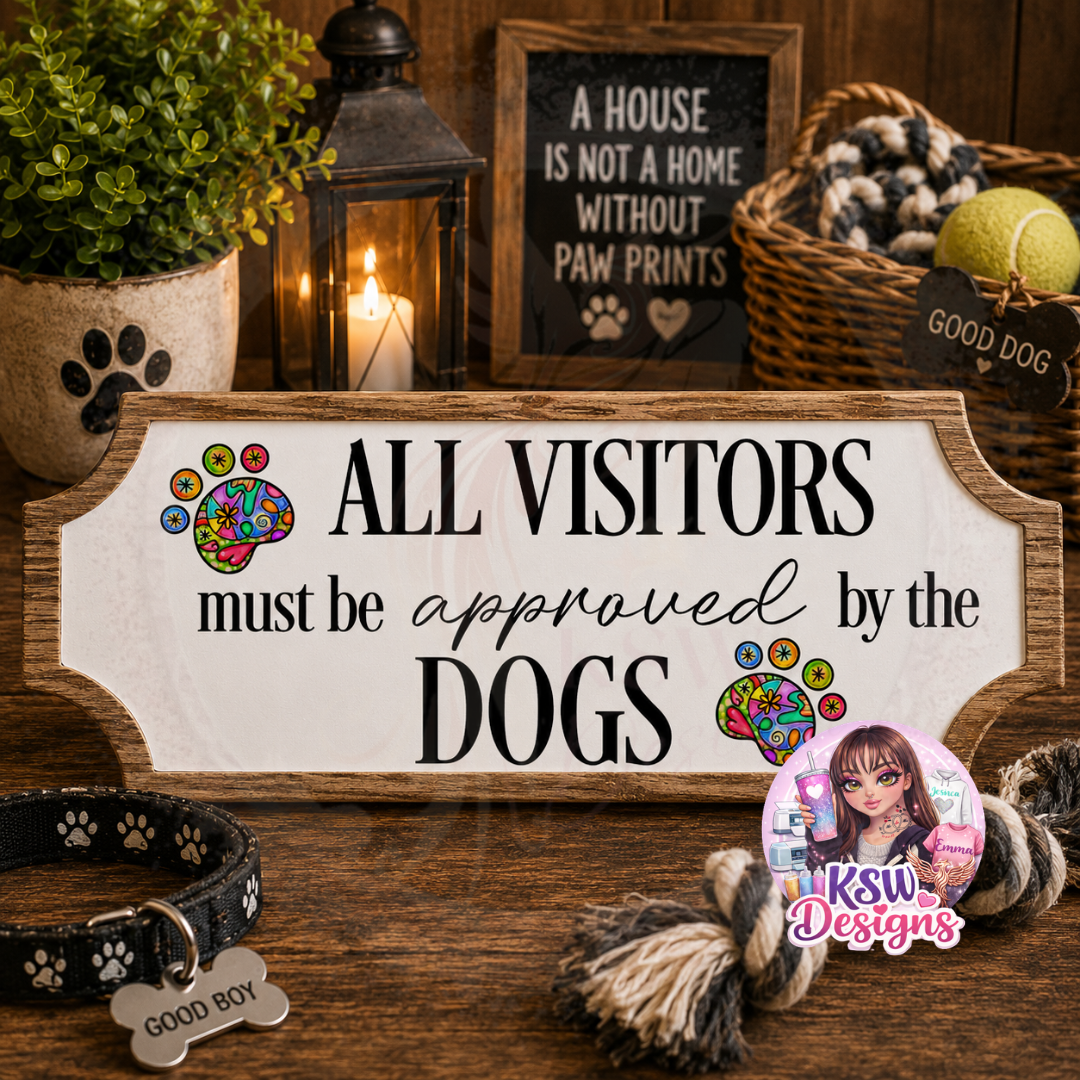 Funny acrylic shelf sign reading All Visitors Must Be Approved By The Dogs with colourful paw print artwork and rustic wood-effect border.
